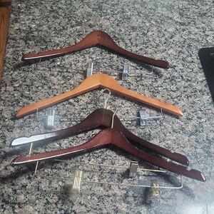 Lot of 4 wooden hangers with pant clips good condition small hook